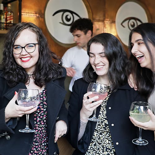 Smiling people drinking gin and tonic